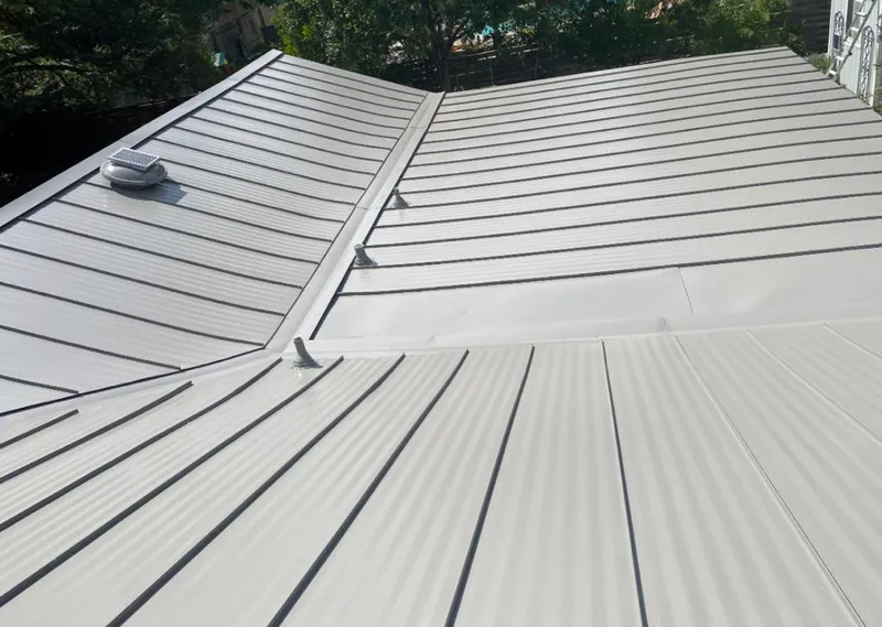 Solar attic fan installed on a metal roof for Roof Ventilation in Mount Hood Villages